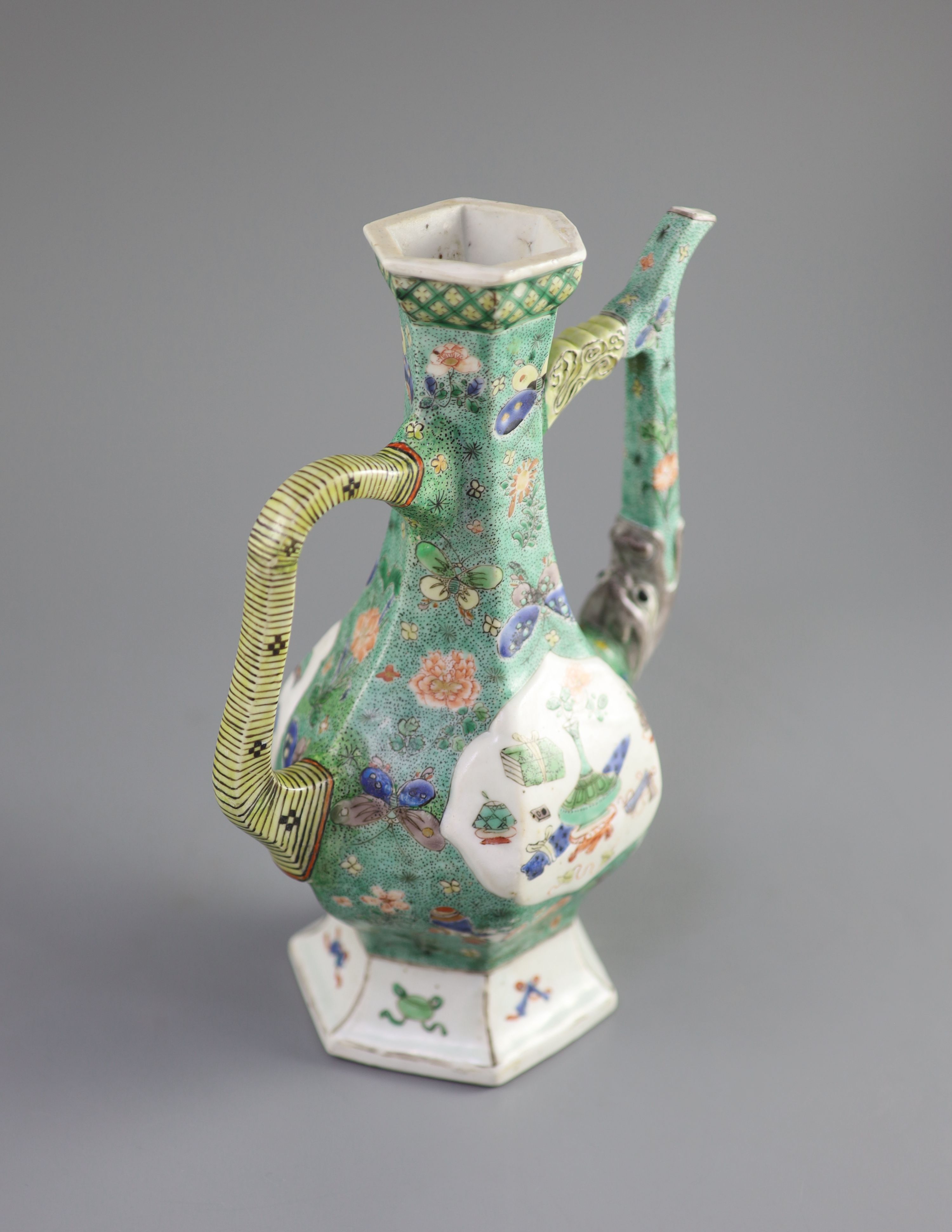 A Chinese famille verte hexagonal wine ewer, Kangxi period (1662-1722), 26cm high, restorations